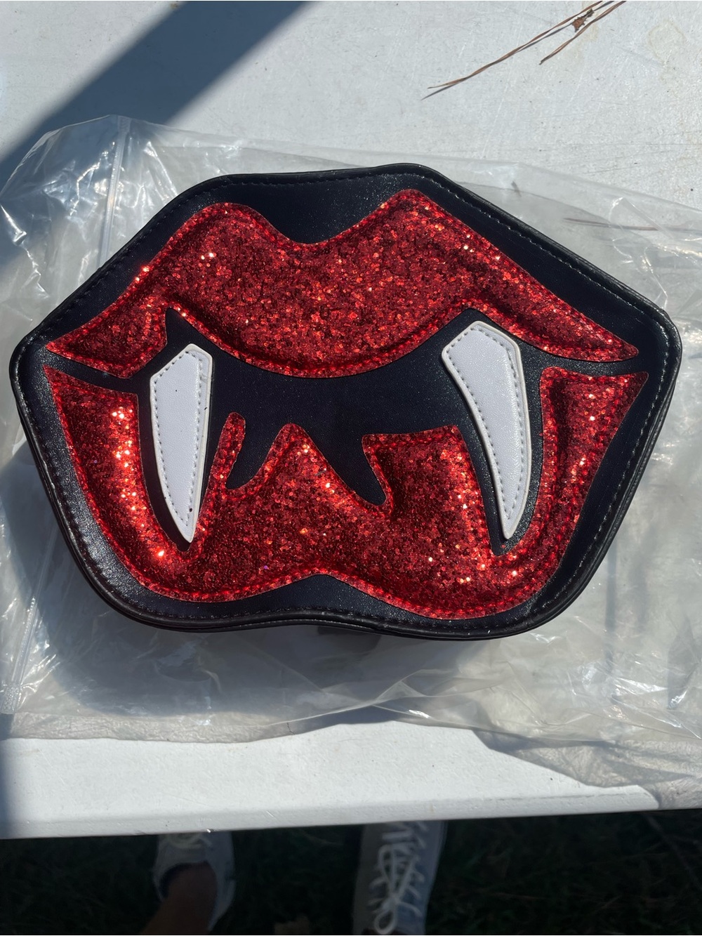Women's Glitter Lip Clutch Bag with White Fang Accents - Red